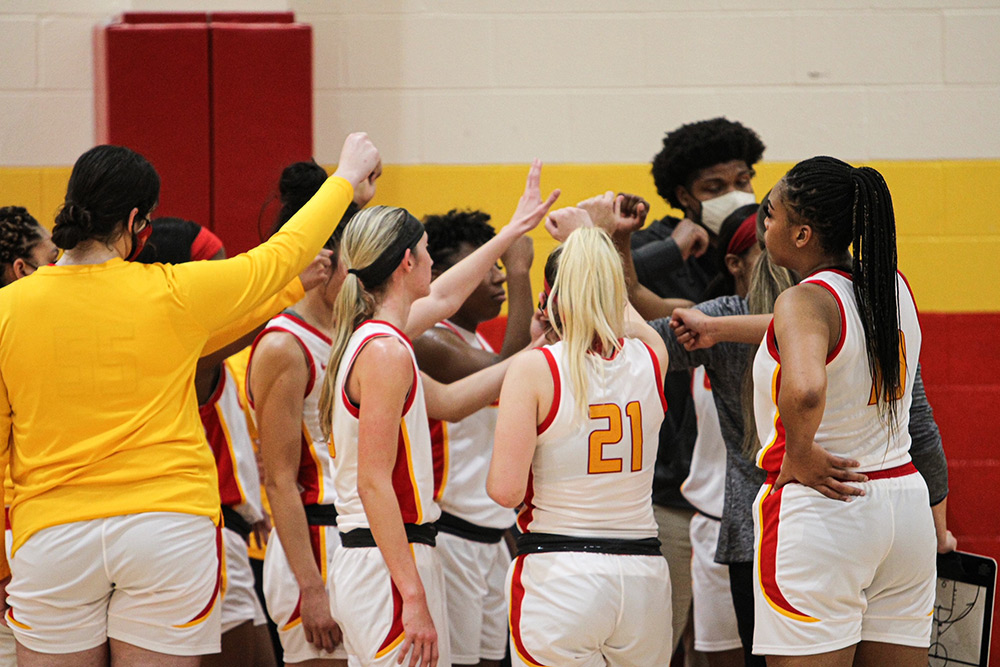University of St. Thomas Girls Basketball team huddle